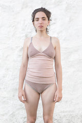 model wearing dusty pink cashmere camisole and undie