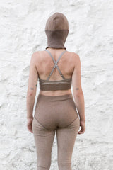 model wearing dark sand cashmere balaclava, bralette and longjohns