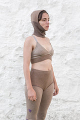 model wearing dark sand cashmere balaclava, bralette and longjohns