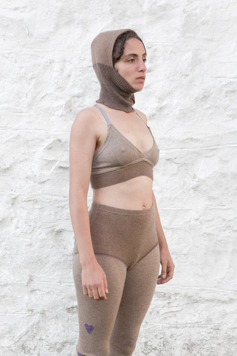 model wearing dark sand cashmere balaclava, bralette and longjohns