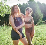 two models each wearing blue and dark sand cashmere underwear