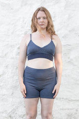 model wearing blue cashmere bralette and bloomer