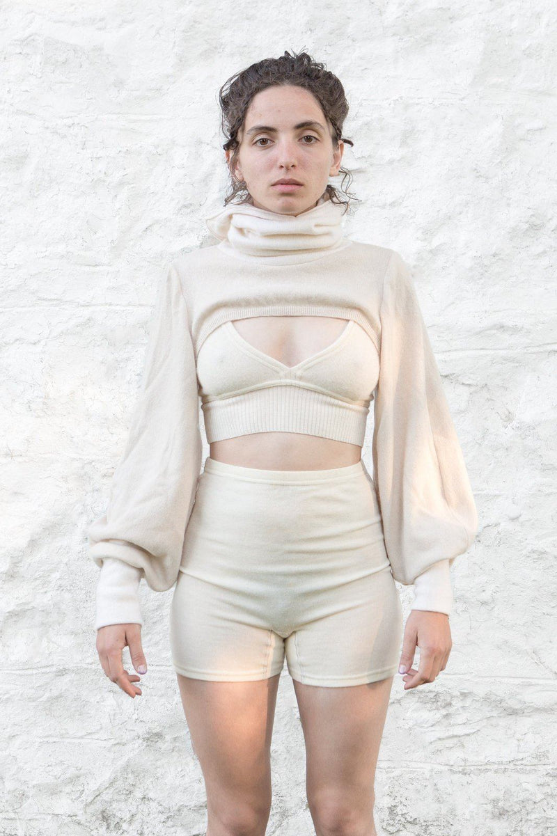 model wearing ivory cashmere bolero, bralette and undie