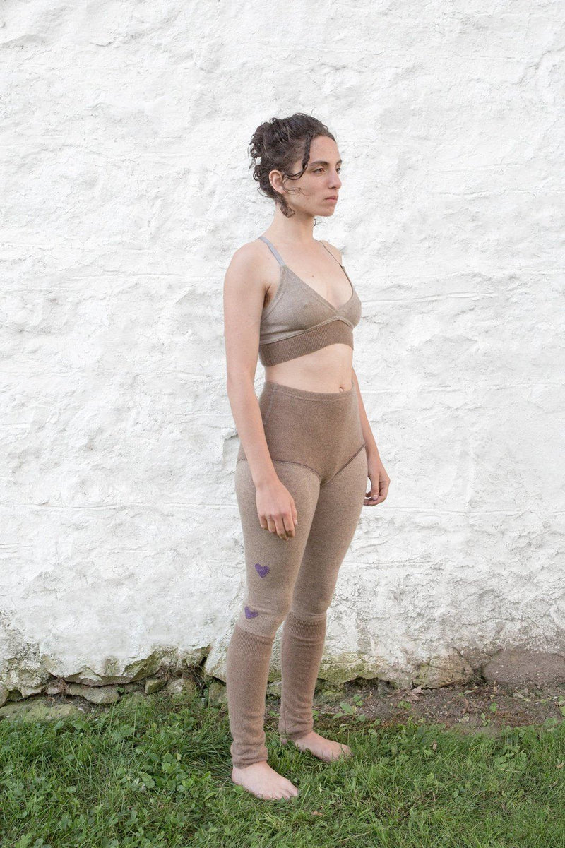 model wearing dark sand cashmere longjohns and bralette