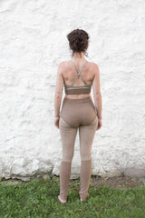 model wearing dark sand cashmere longjohns and bralette