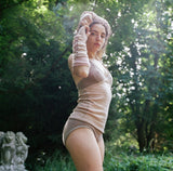 model wearing dusty pink cashmere camisole and undie