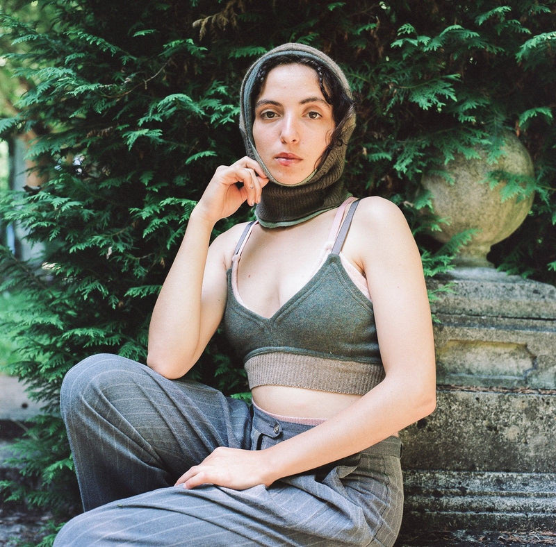 model wearing brown and green cashmere balaclava, bralette and undie