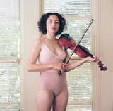 model wearing pink cashmere bralette and undie