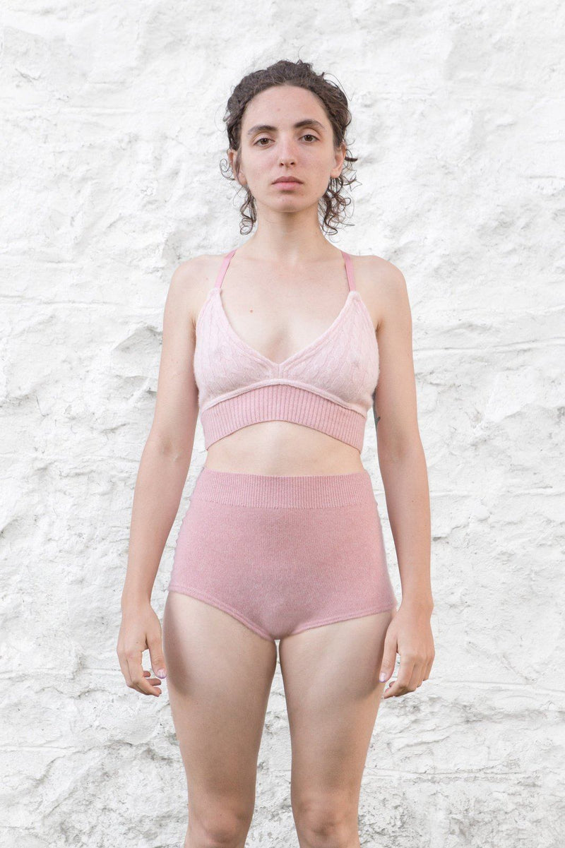 model wearing pink cashmere bralette and undie